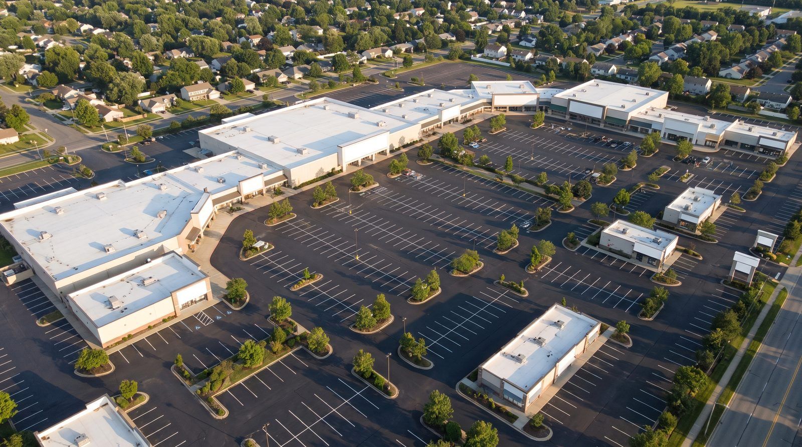 Open air retail development seen from the air in late afternoon light